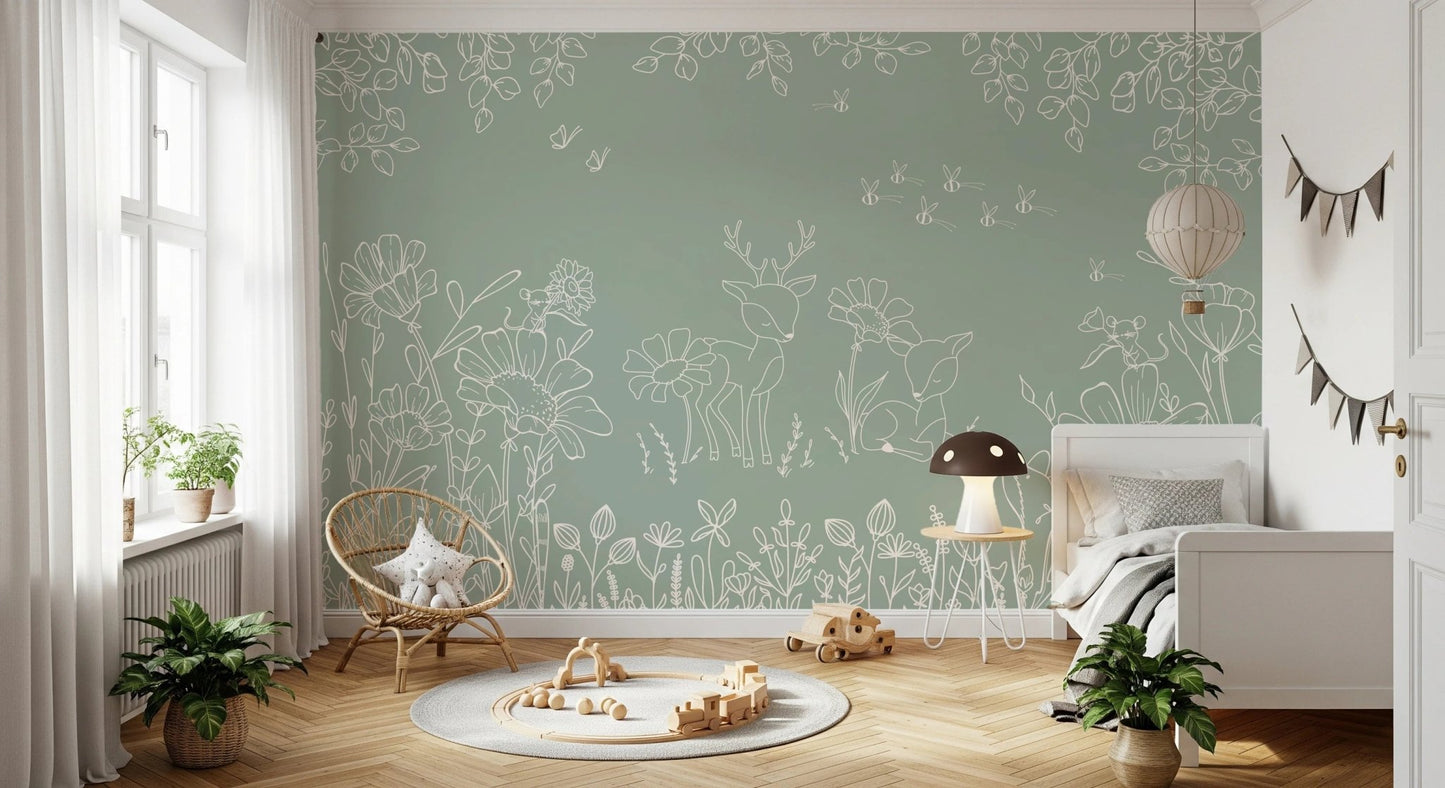 Nature inspired green wall mural with white illustrations for a child’s bedroom.