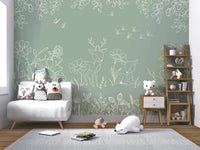 Contemporary green wall mural with meadow doodles in a nursery setting.