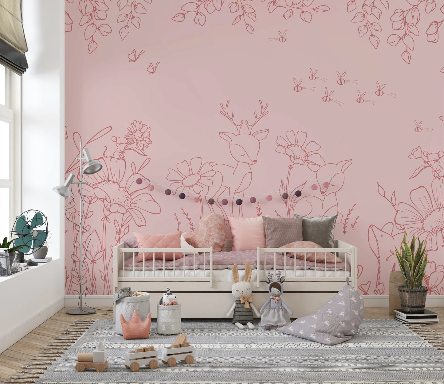 Hand-drawn pink animal wall mural in a playroom featuring a white bed