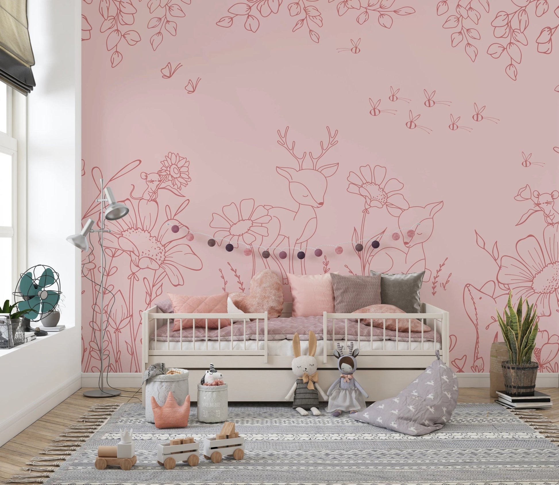 Hand-drawn pink animal wall mural in a playroom featuring a white bed