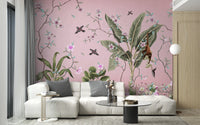 Pink floral wall mural behind a white modular sofa in a contemporary flat.