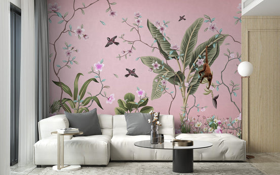 Pink floral wall mural behind a white modular sofa in a contemporary flat.