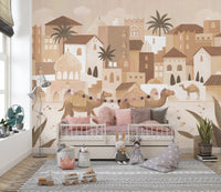 Neutral toned desert city wall mural in a children’s bedroom with a wooden bed.