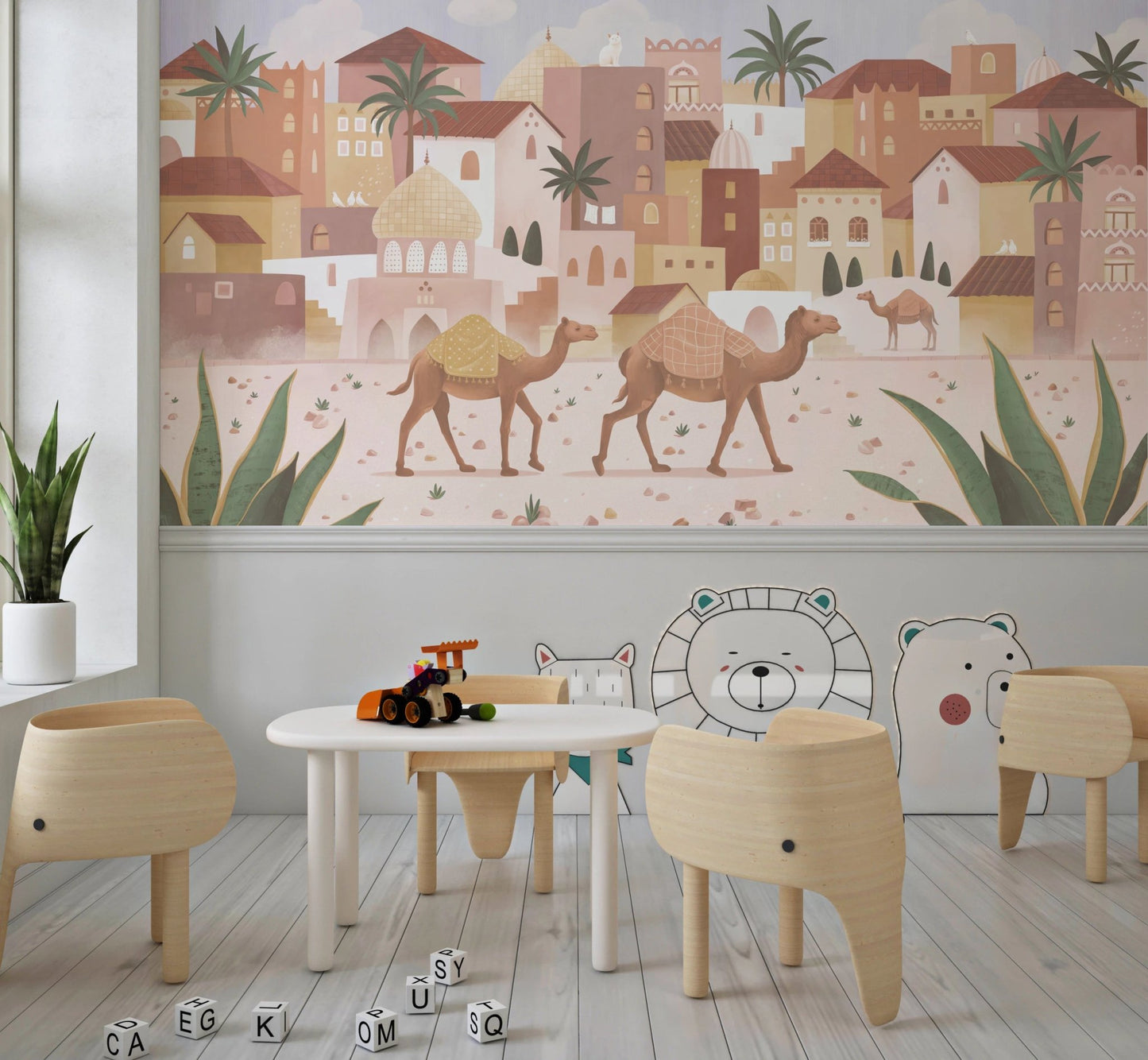 Small study desk for kids placed in front of a Desert Dreams wall mural.