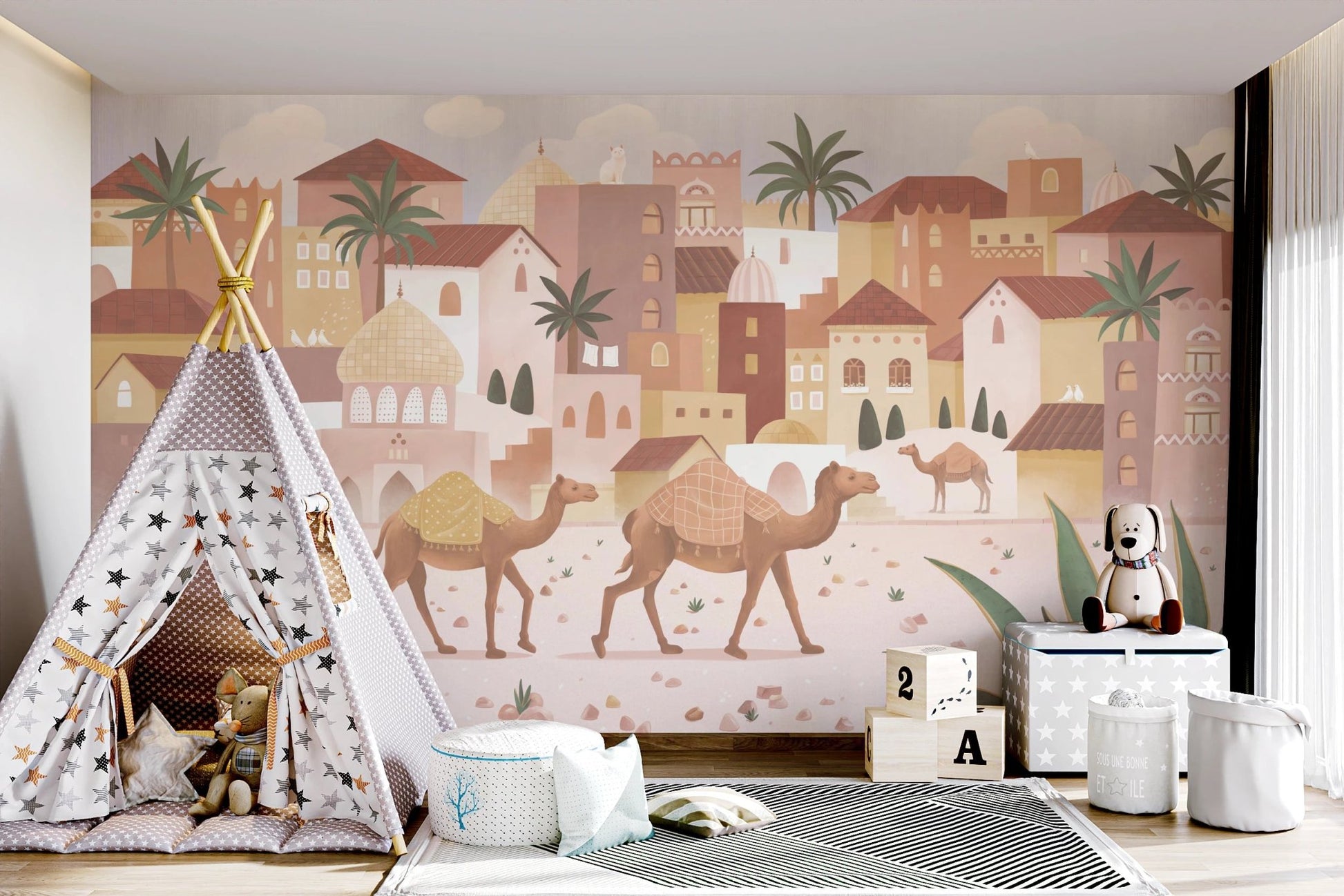 Playroom with a fabric teepee tent set against a desert-themed wall mural.