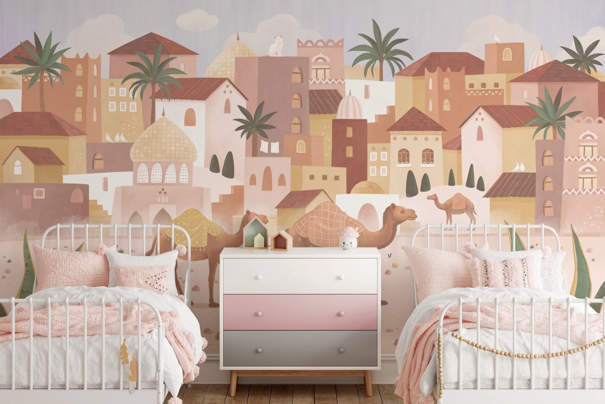 Twin bedroom wall mural with desert town scenery and a pink storage cabinet.