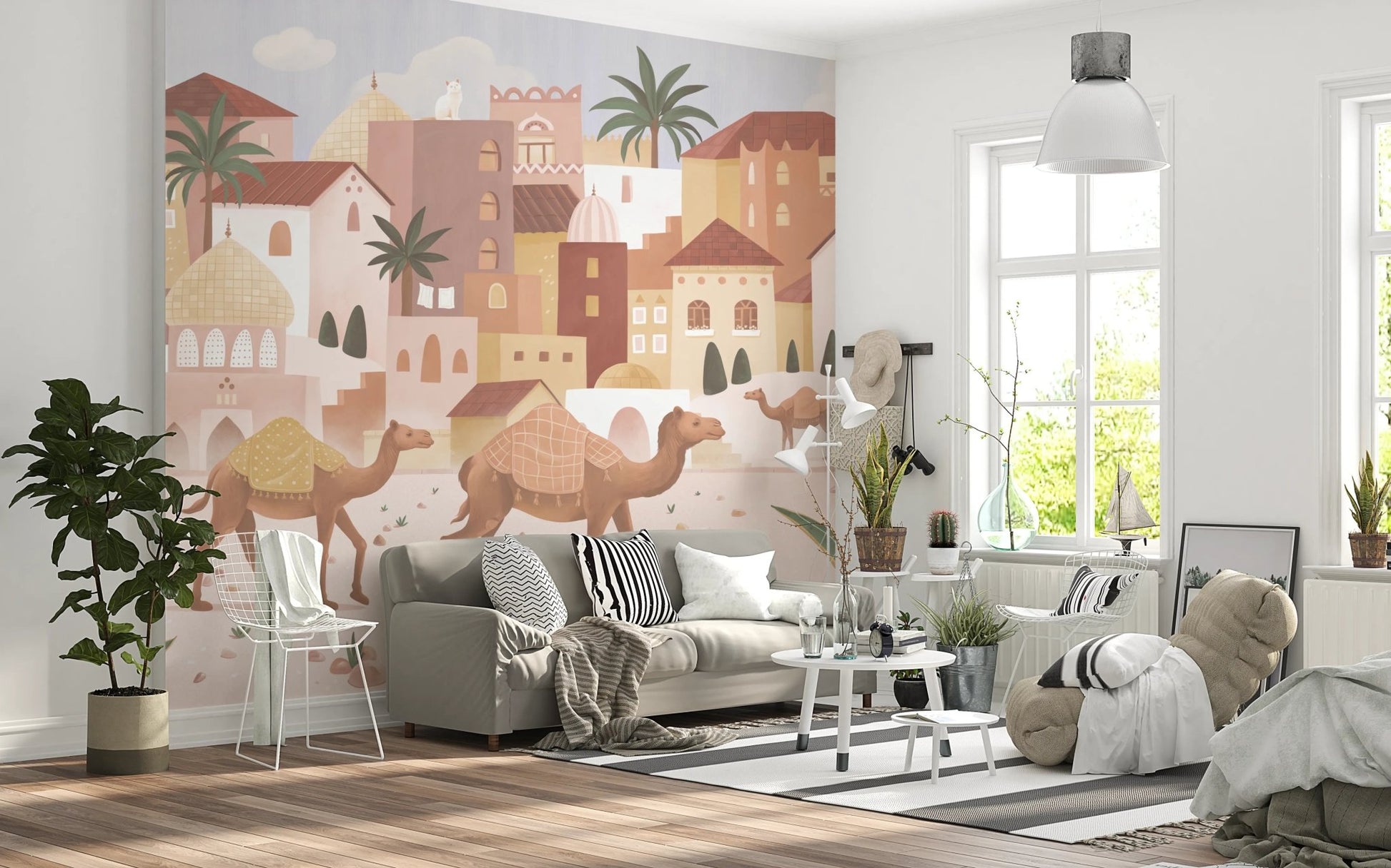 Living room setting with a desert landscape wall mural behind a grey modern sofa.