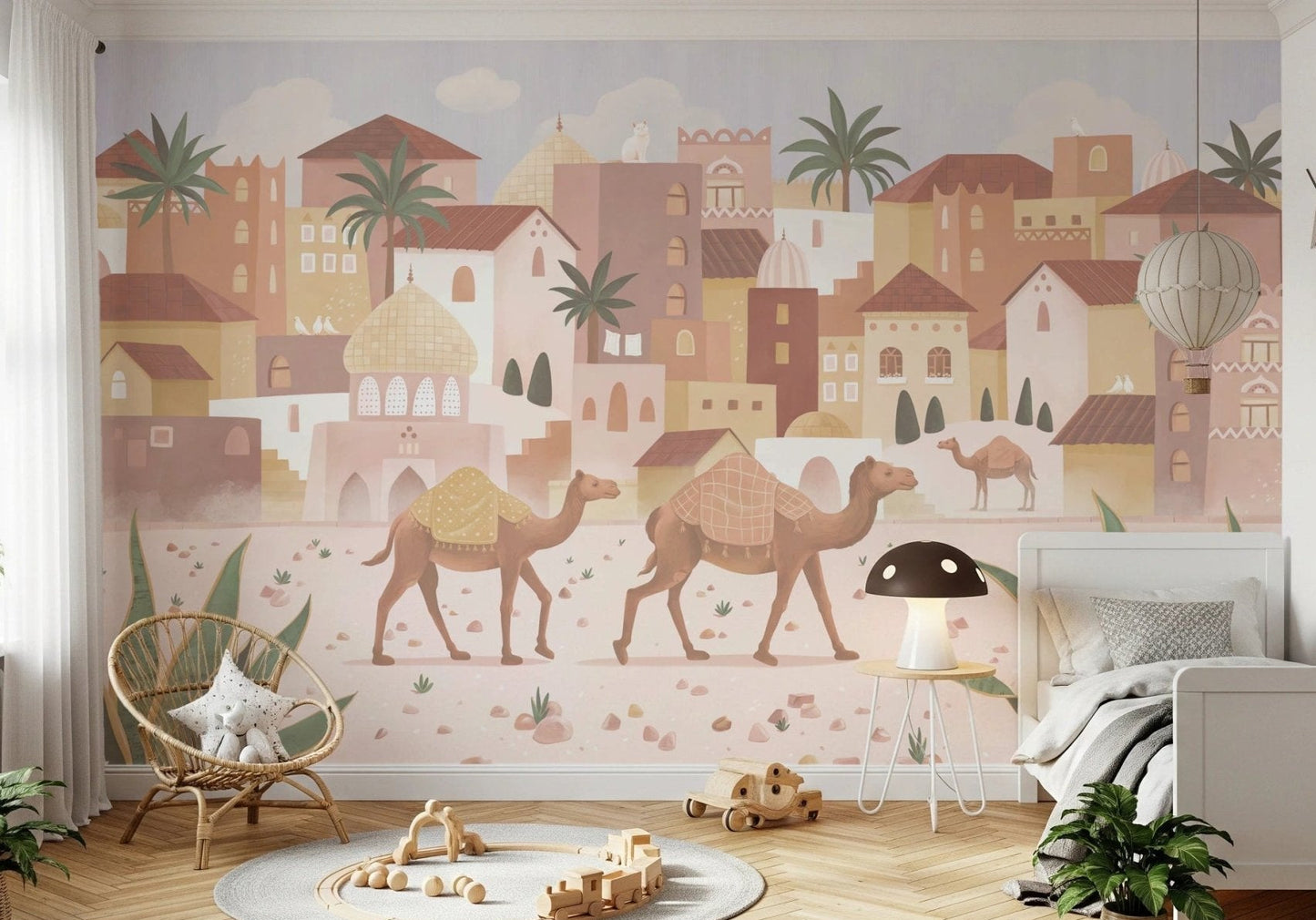 Desert Dreams Wall Mural in a minimalist bedroom with a wooden crib and round rug.