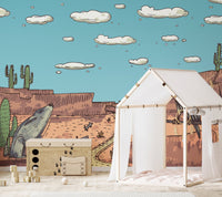 Stunning desert safari mural with golden sand and wildlife in play room.
