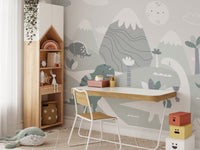 Grey and green dinosaur wall mural paired with a wooden study desk and chair.
