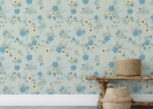 Ditsy blooms pastel blue wallpaper with delicate blue and cream floral patterns.