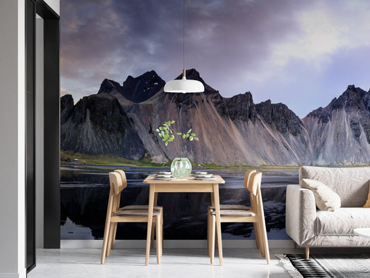 Modern apartment dining area with scenic Icelandic landscape wall mural.