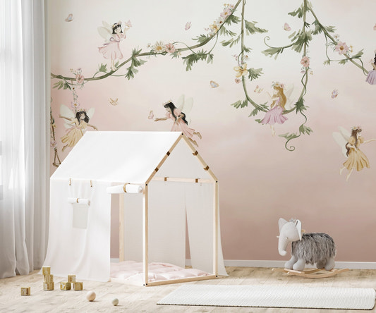 Watercolor fairies swinging on leafy branches wall mural.