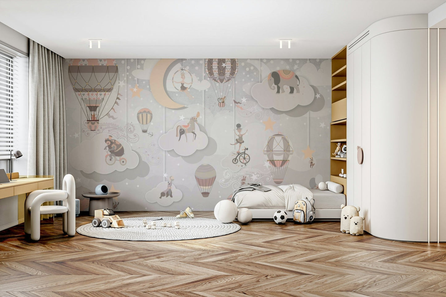 Nursery wall decor featuring soft clouds and circus tent details.