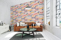 Colorful quote pattern wallpaper mural with playful brush script details.