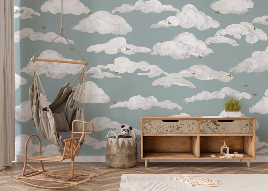 Dreamy dancing skies wallpaper mural with white clouds on blue sky.