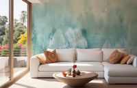 Living room with a white sofa and a large teal forest landscape wall mural on the main wall.