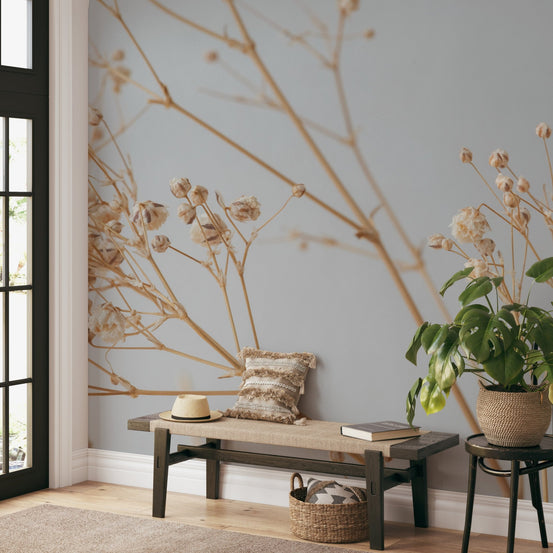Dried floral botanical wallpaper with delicate beige stems on gray.
