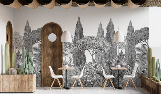 Grey deodar mural with dreamy forest vibes in a cafe with white chairs.