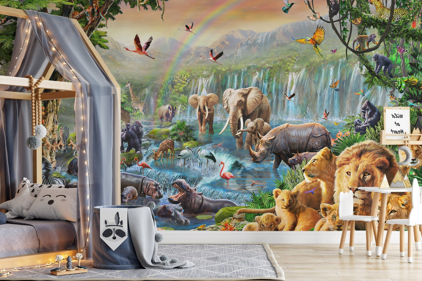 Safari animal wall mural behind a grey house-shaped bed frame and rug.