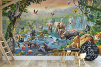 Dynamic Animal Kingdom wall mural with a wooden desk and chalkboard in a study area.