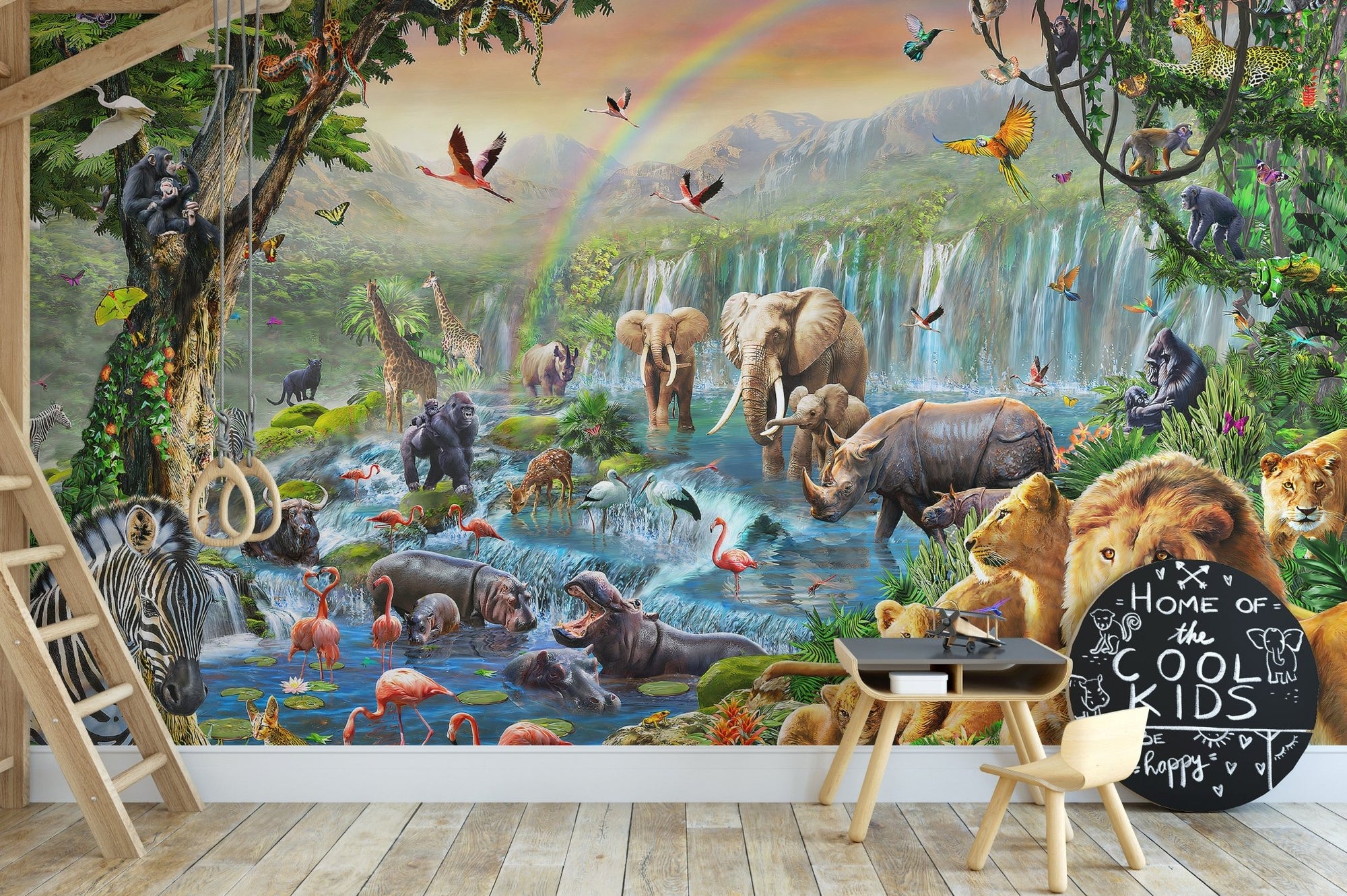 Dynamic Animal Kingdom wall mural with a wooden desk and chalkboard in a study area.