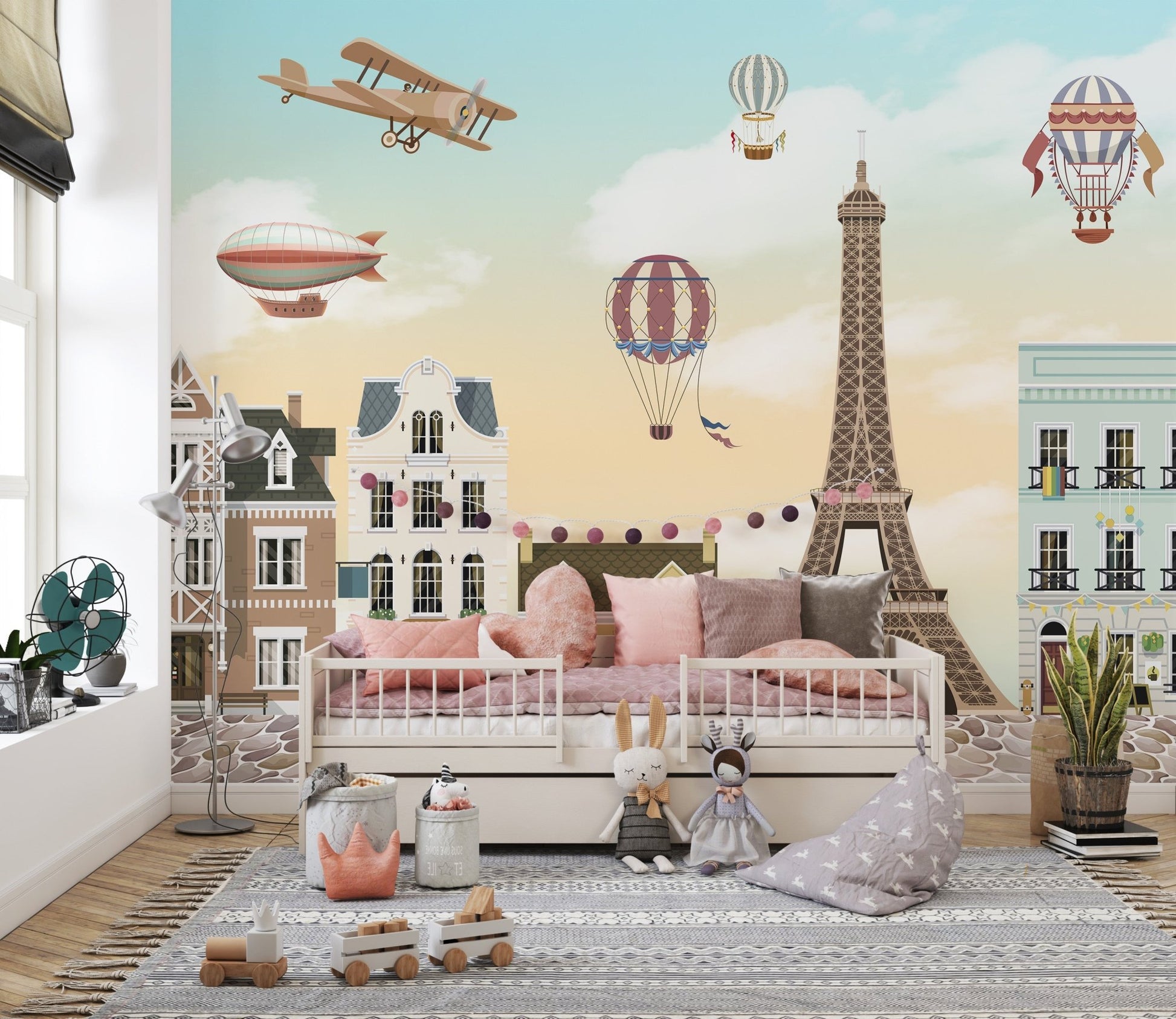 Eiffel Tower City Wall Mural in a light-filled toddler bedroom.