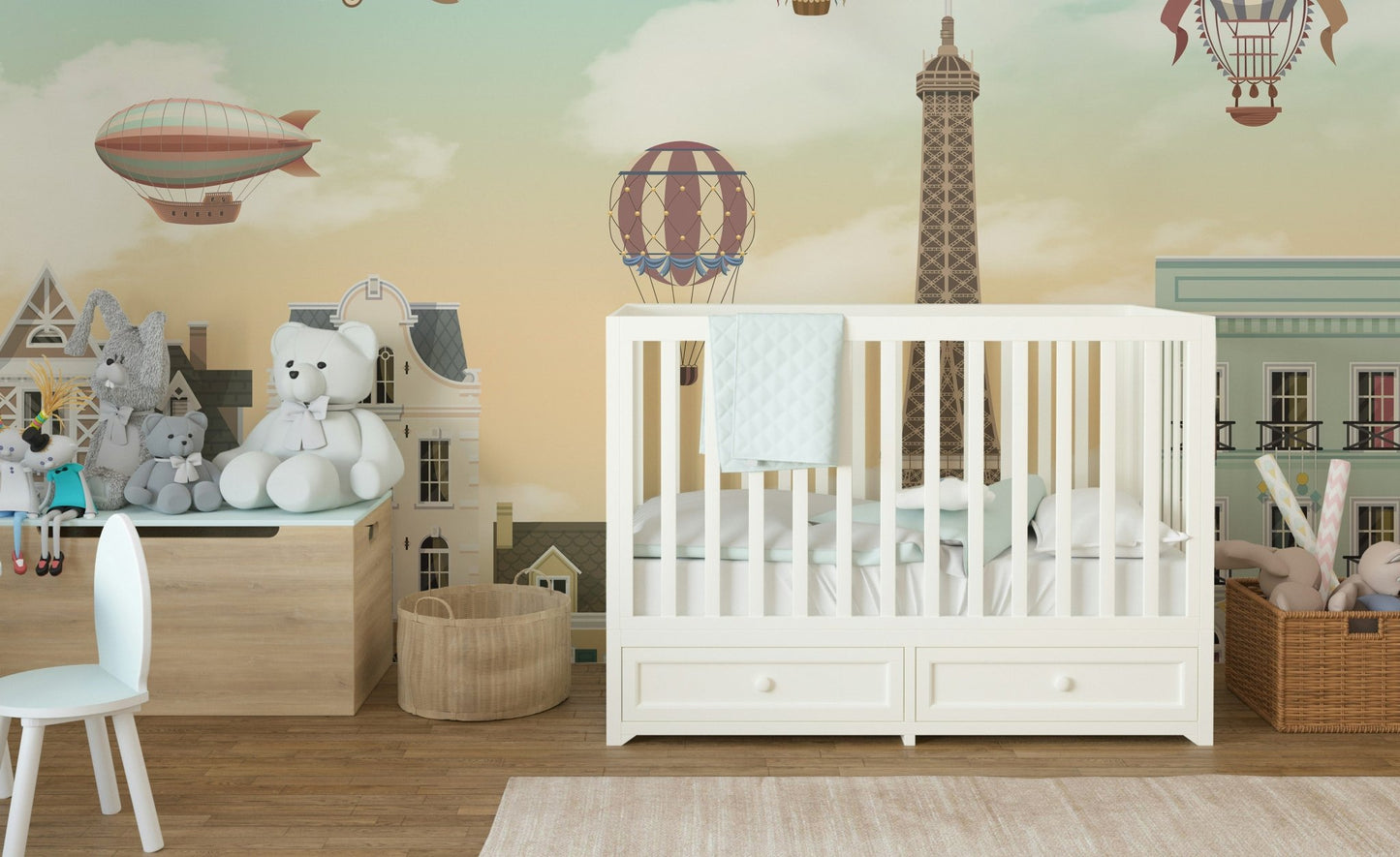 Baby's sleeping area with Eiffel Tower City Wall Mural.
