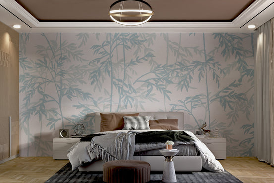 Pale blue branch and leaf silhouettes on a large wall mural.