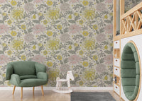 Traditional flower motif wallpaper in muted yellow and blush shades.