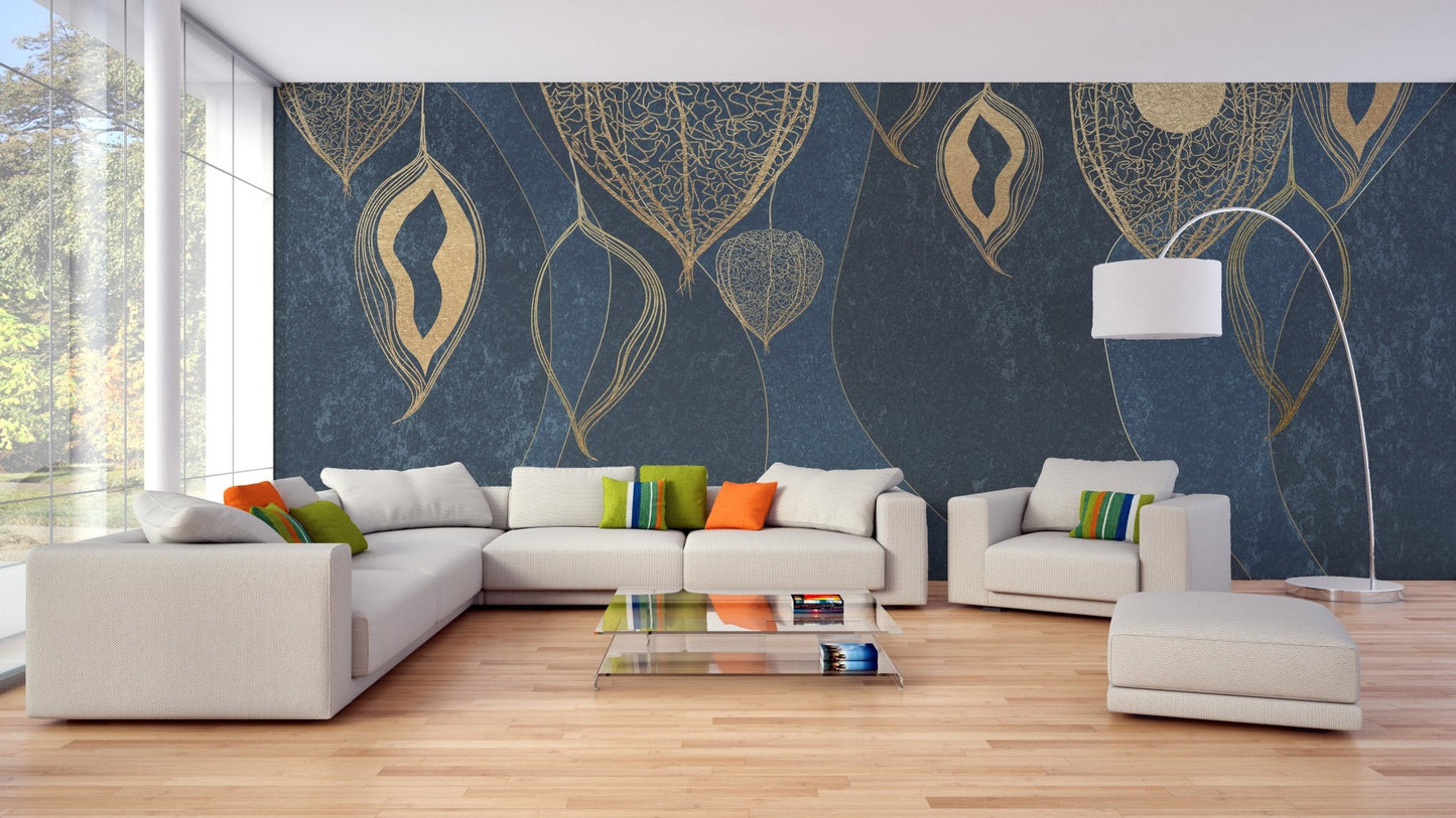 Large golden leaves wall mural behind a white sectional sofa in a bright living area.