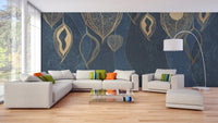 Large golden leaves wall mural behind a white sectional sofa in a bright living area.