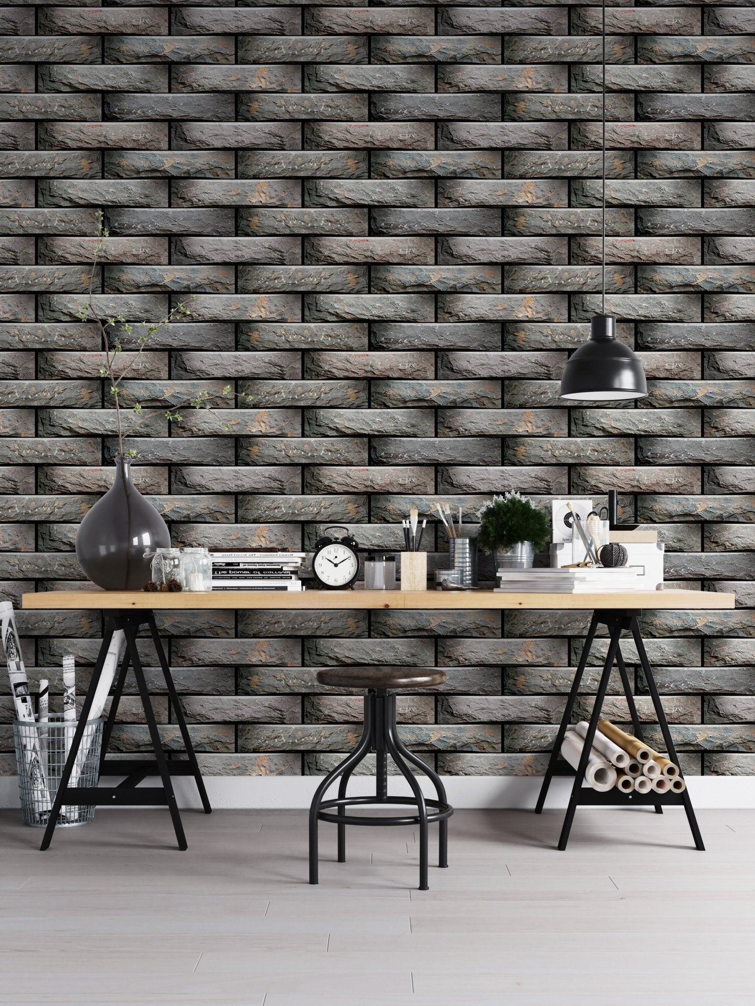Workspace featuring a dark grey tile wallpaper and a black desk.
