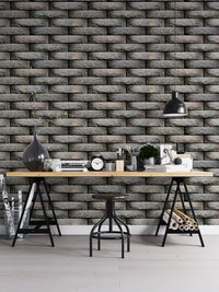 Workspace featuring a dark grey tile wallpaper and a black desk.