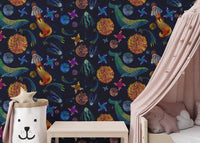 Embroidery style space wallpaper in a nursery with a pink canopy and white cot.