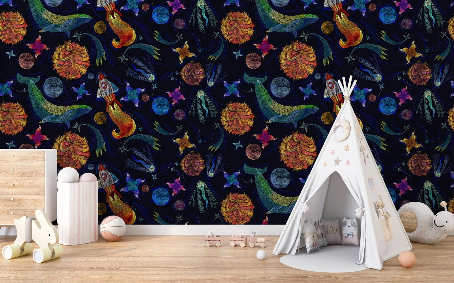 Planet adventure wallpaper in a child's playroom with a white teepee tent.