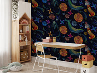 Dark blue wallpaper with embroidered star motifs in a study room with a wooden desk.