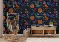 Embroidery inspired space adventure wallpaper in a room with a wooden rocking chair.