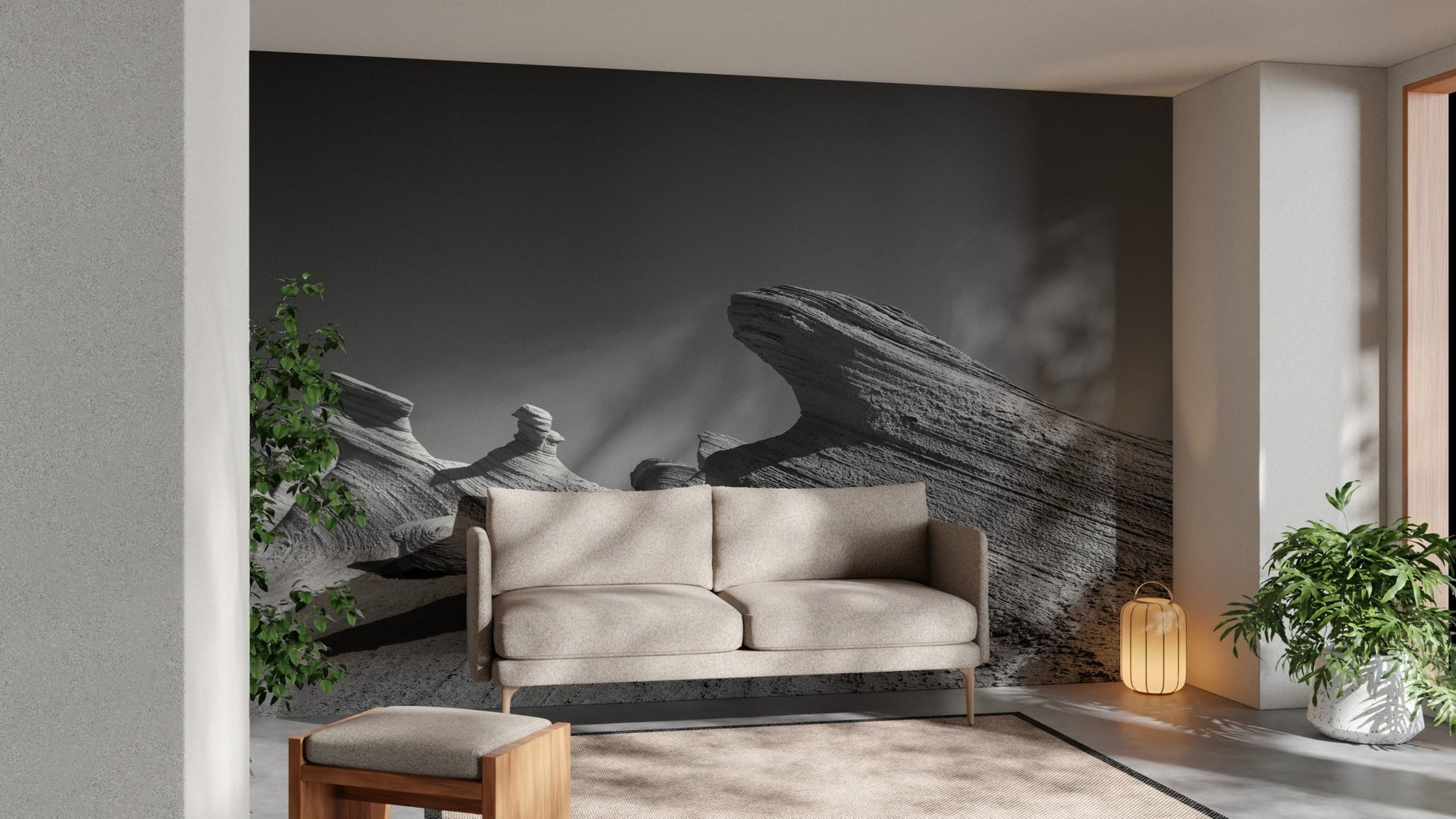 Grey rock formation wall mural behind a beige couch in a sunlit lounge