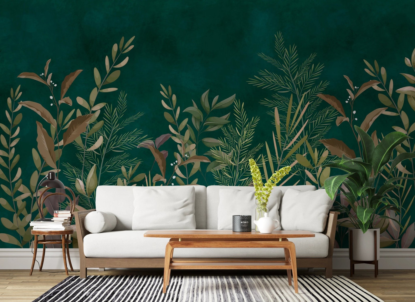 Emerald green botanical wall mural behind a white sofa and wooden coffee table