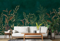Emerald green botanical wall mural behind a white sofa and wooden coffee table