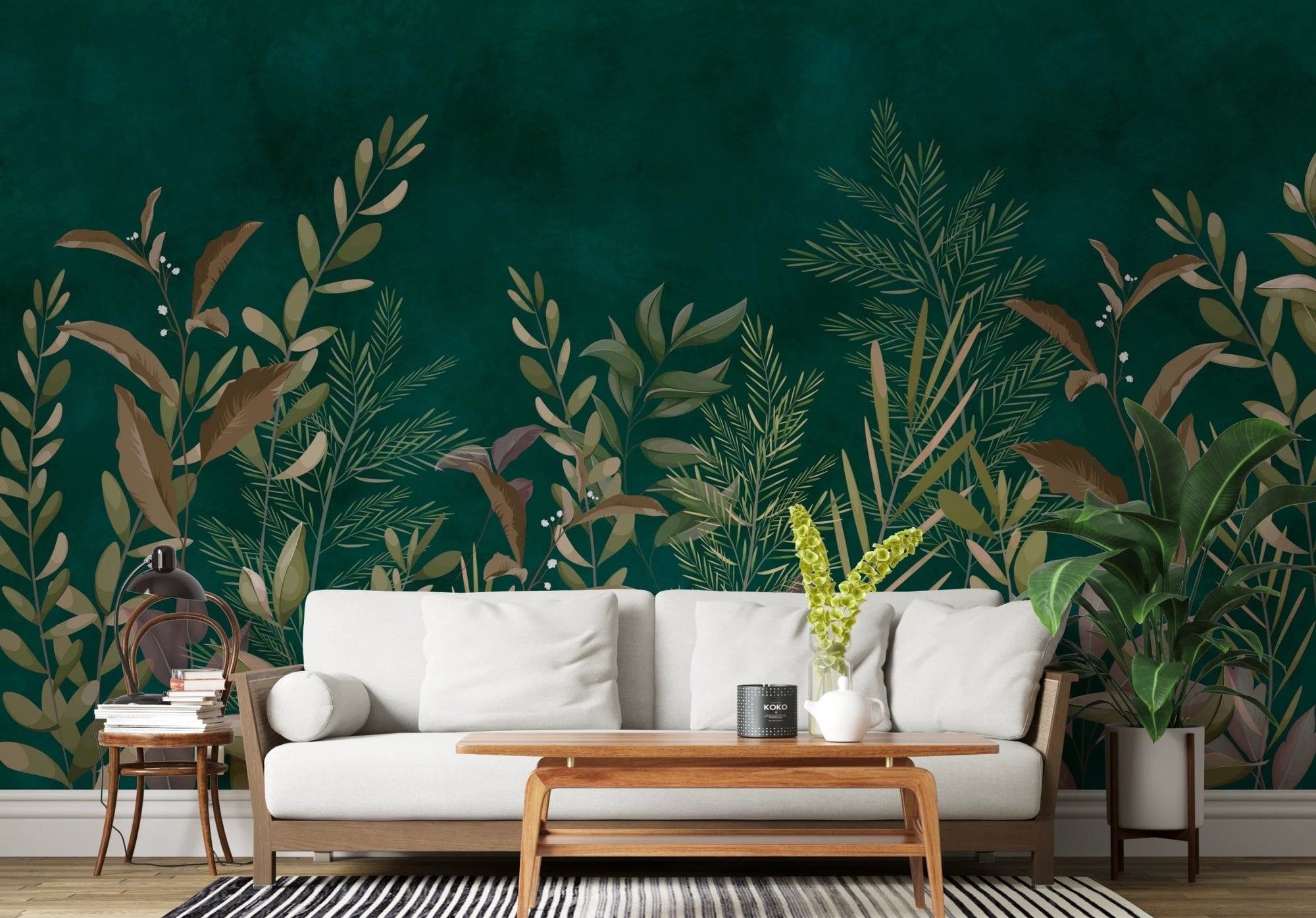 Emerald green botanical wall mural in minimalist seating area.