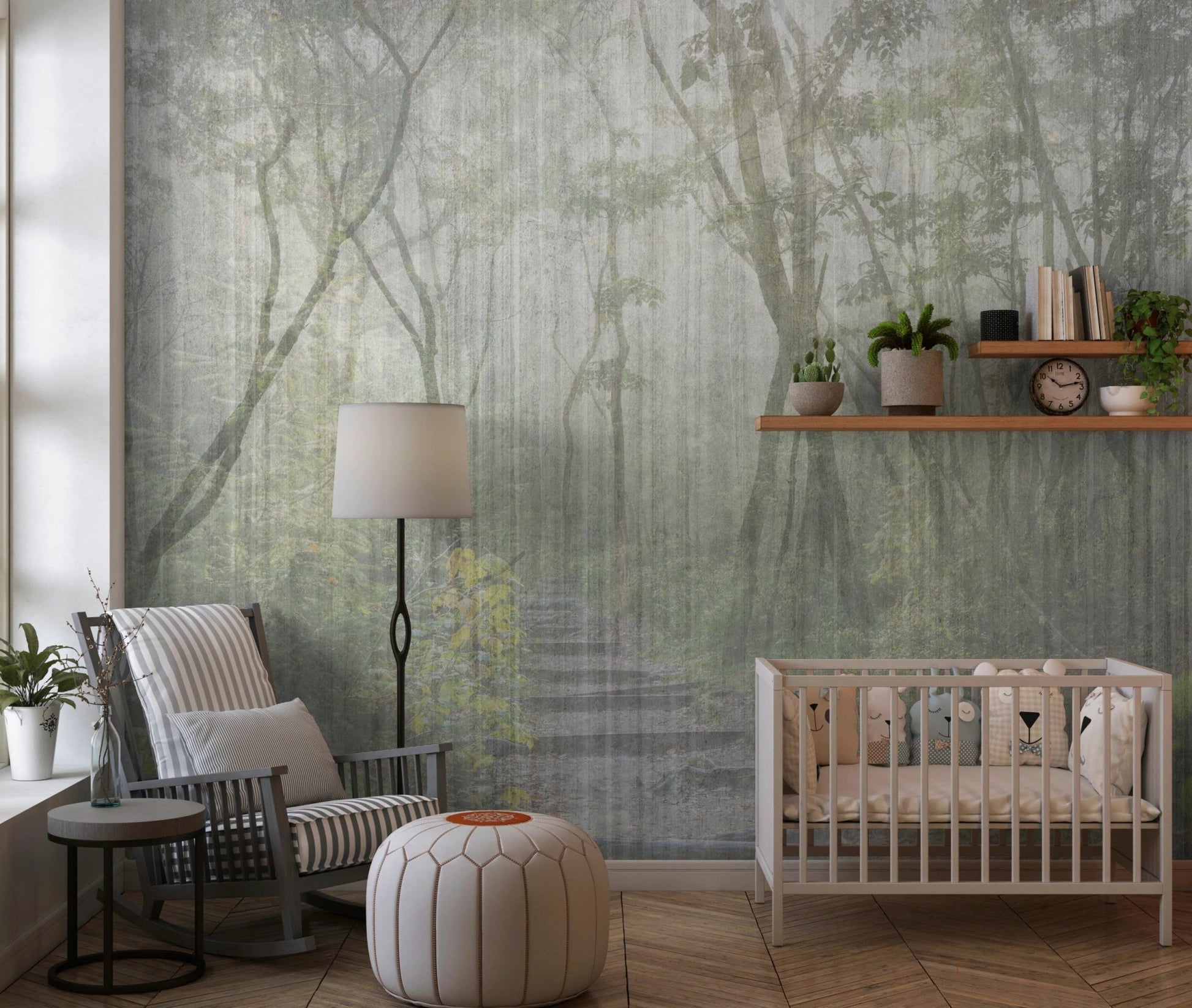 Nursery room featuring a misty forest wall mural with a white crib and grey chair.