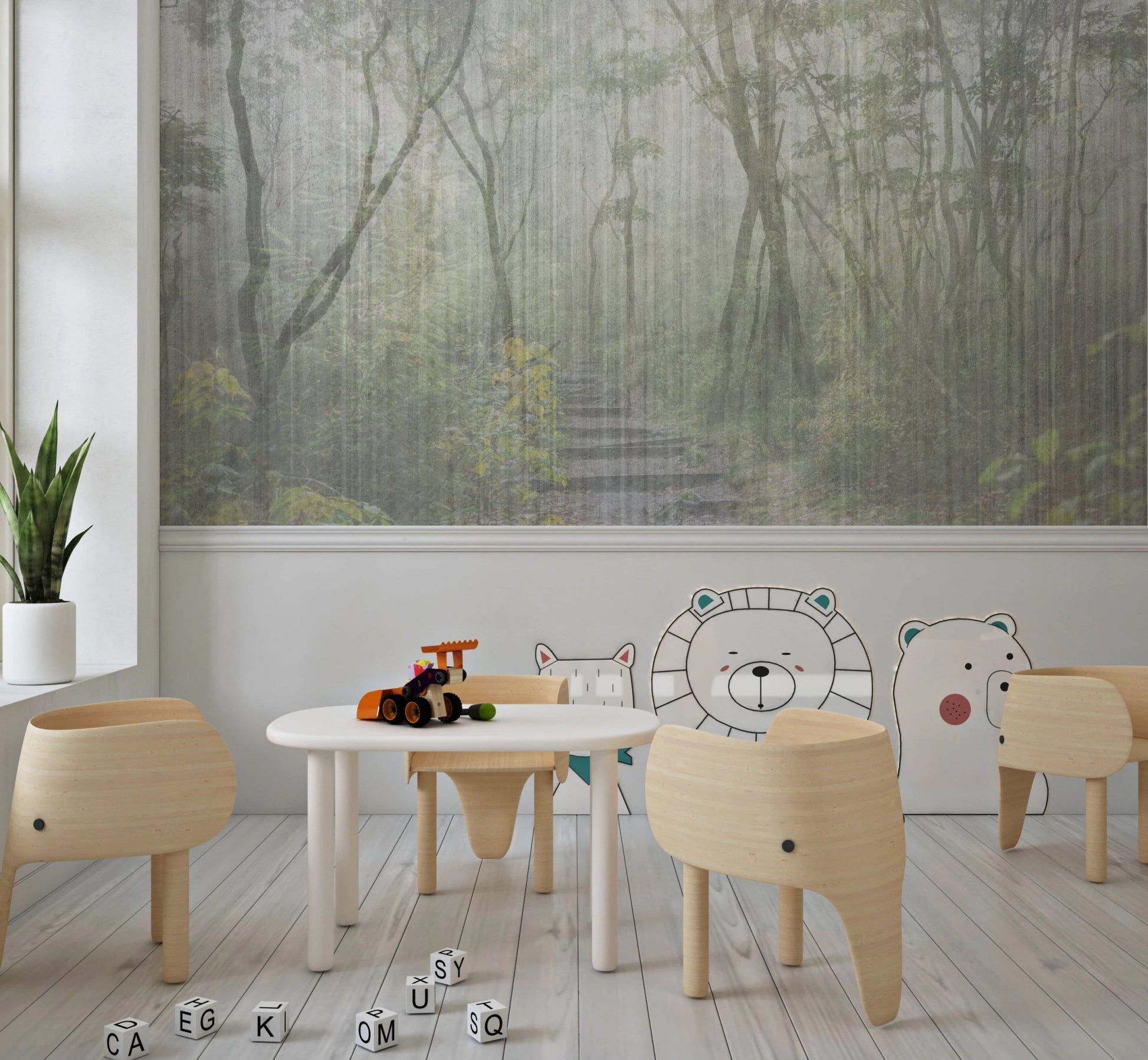 Kids play area with a forest wall mural behind small white tables and chairs.