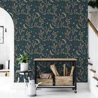 Staircase landing area featuring esoteric crescent moon and floral background wallpaper.