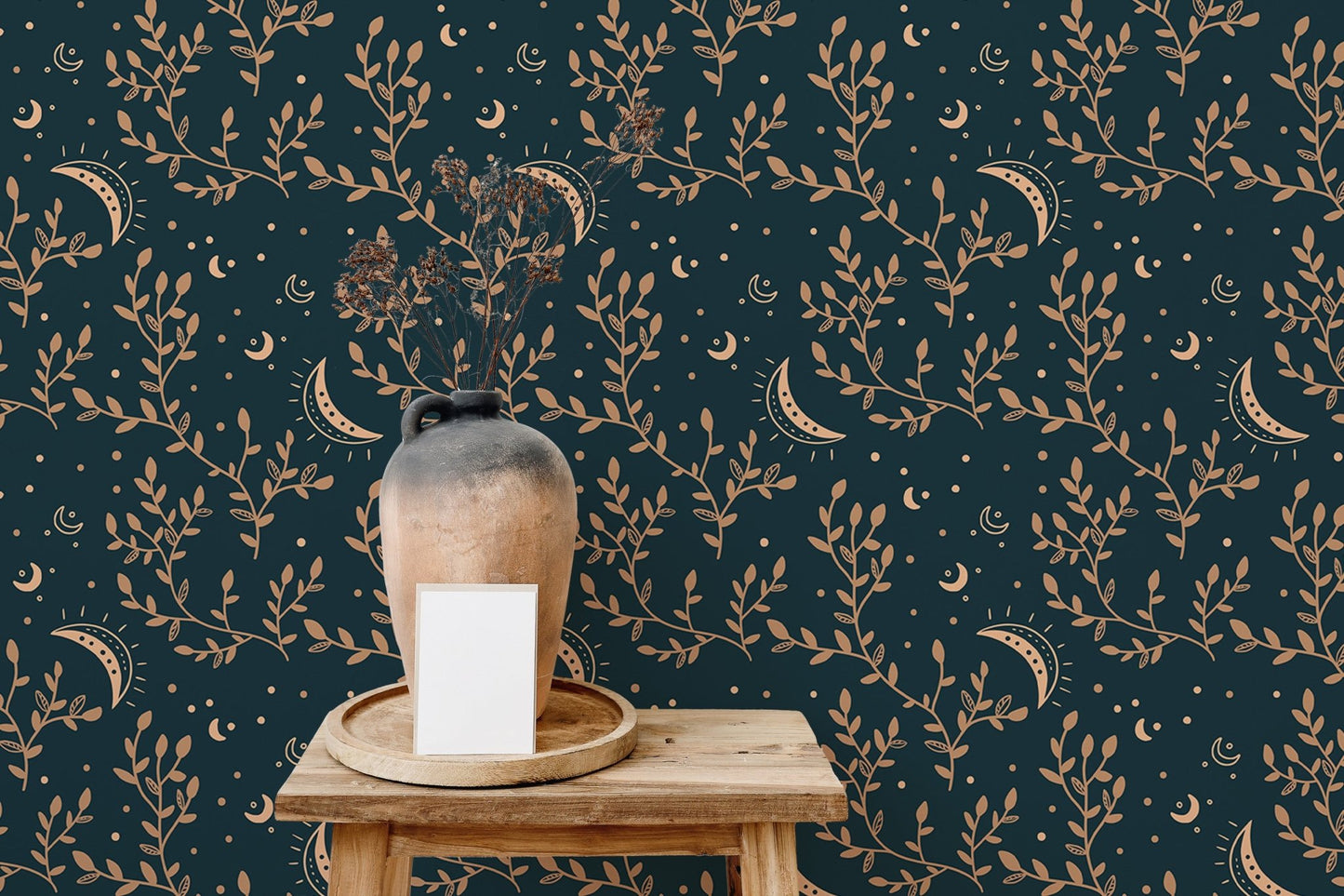 Wooden stool with a ceramic vase against esoteric crescent moon and floral wallpaper.
