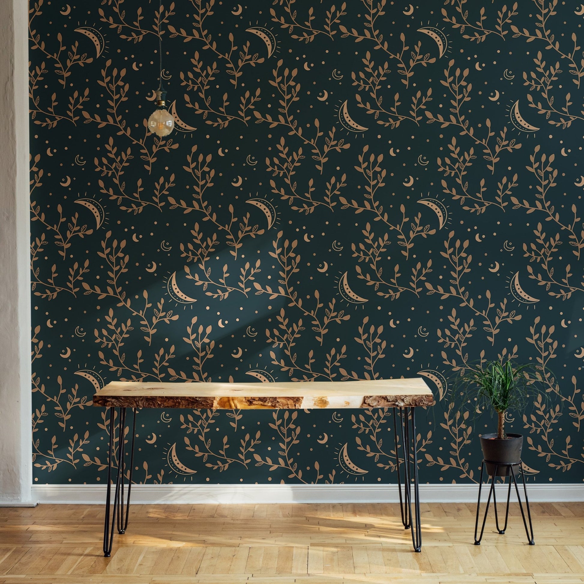 Entryway console table with gold celestial patterns on a floral wallpaper