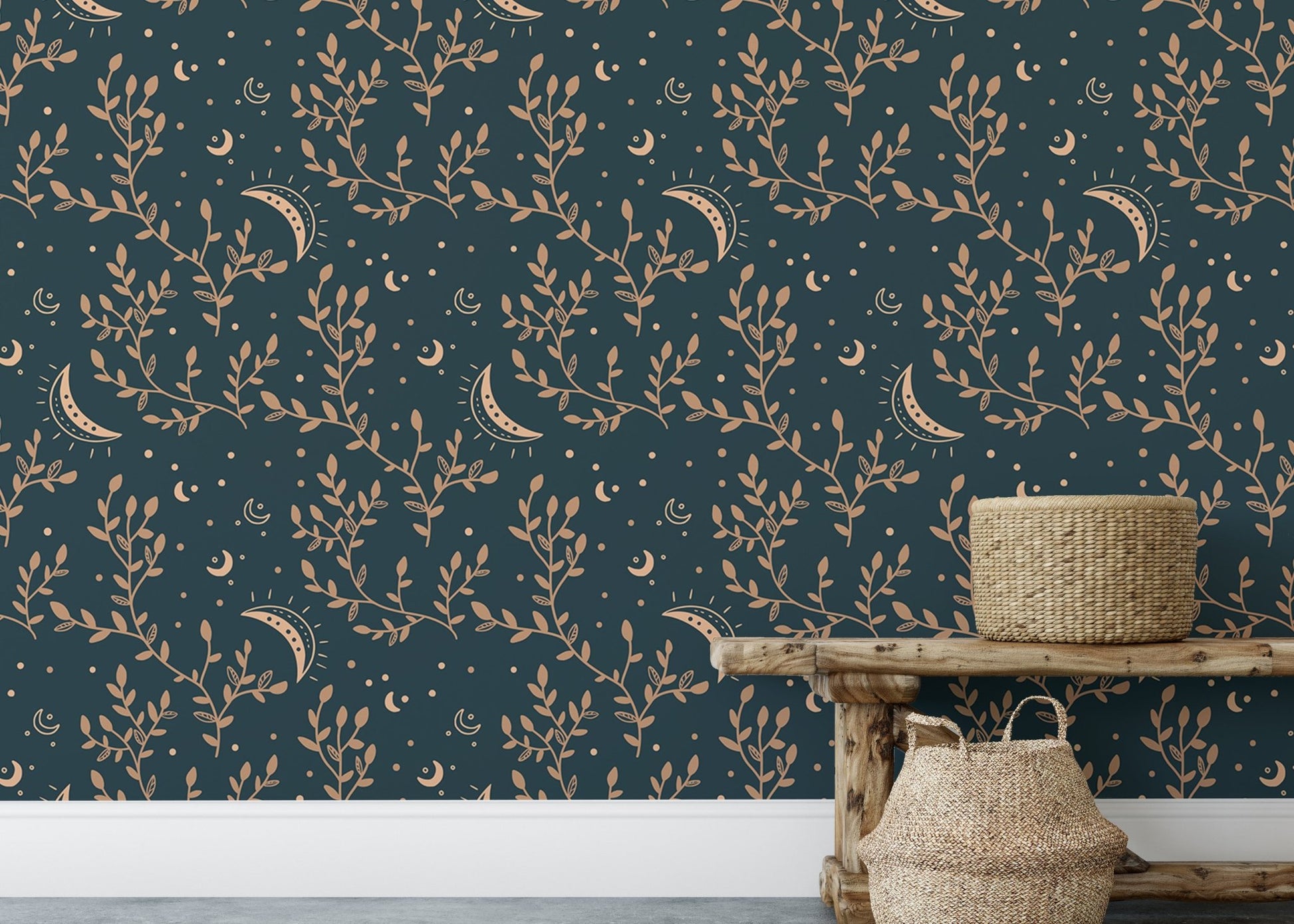 Low wooden bench with woven baskets in front of crescent moon and floral wallpaper.