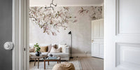 View through a doorway showing a living with pink blossom wall mural.