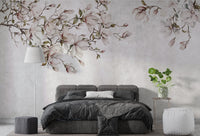 Bedroom with black bedding and pink floral blossom wall mural.